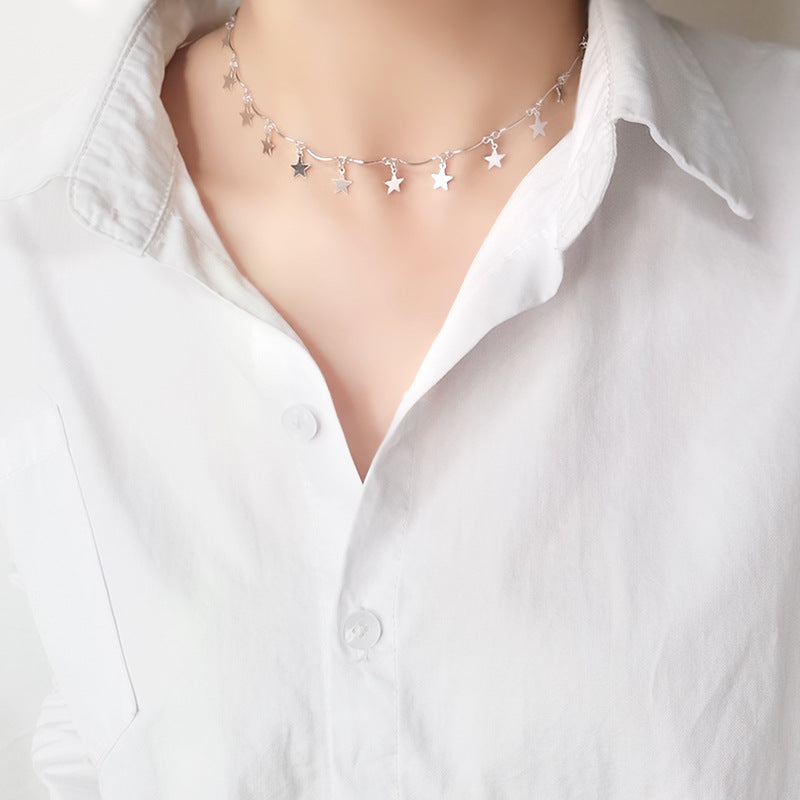 Elegant silver-plated star necklace with a chain of small stars, designed to enhance your celestial-themed jewelry collection.