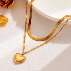 Dazzling 18K gold-plated heart pendant necklace with dual chains, elegantly showcasing the message 'Love You'.