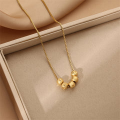 Beautiful 18K gold-plated necklace showcasing four decorative balls, ideal for elevating your jewelry collection.
