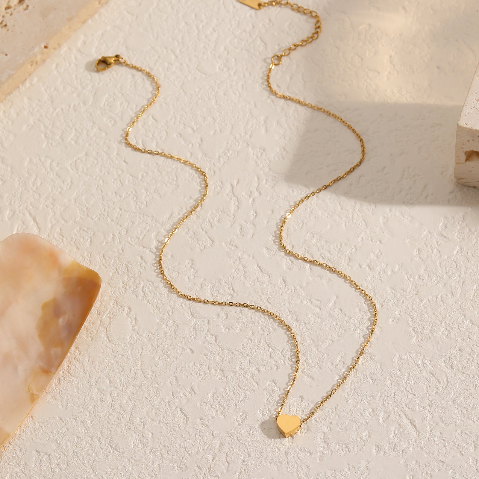 Delicate 18K gold-plated heart necklace on a small chain, a lovely accessory for expressing love and style.