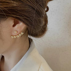 Elegant 18K gold-plated stud earrings featuring two gold balls adorned with delicate beads for a chic look.