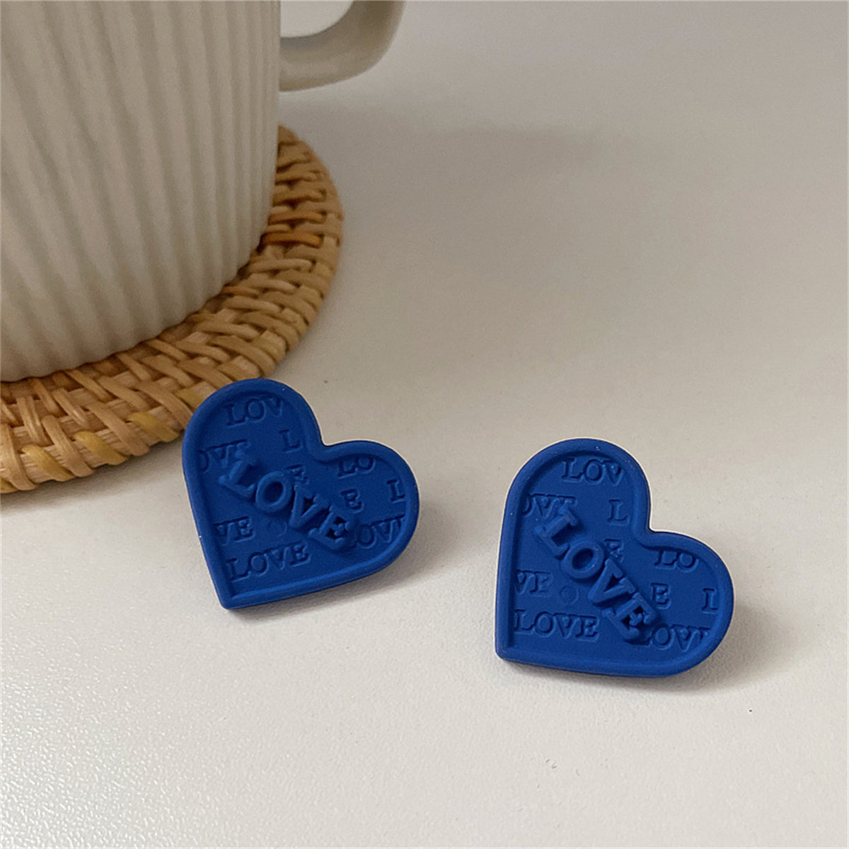 Blue Enamel and Silver-Plated 'Love' Heart Stud Earrings, silver stud earrings for women, vintage-inspired design, side view
