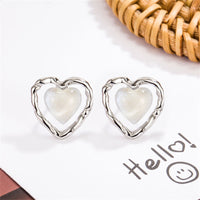 Quartz & Silver-Plated Openwork Heart Stud Earrings