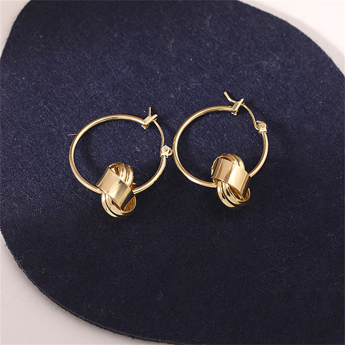 18K Gold-Plated Knot Huggie Earrings, gold huggie earrings, botanical inspired, detail close-up