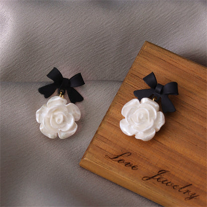 Black Enamel and Resin 18K Gold-Plated Bow Flower Drop Earrings, gold drop earrings for women, detail close-up