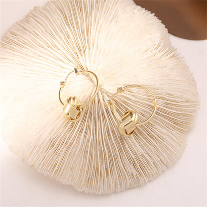 18K Gold-Plated Knot Huggie Earrings, gold huggie earrings, botanical inspired, lifestyle look