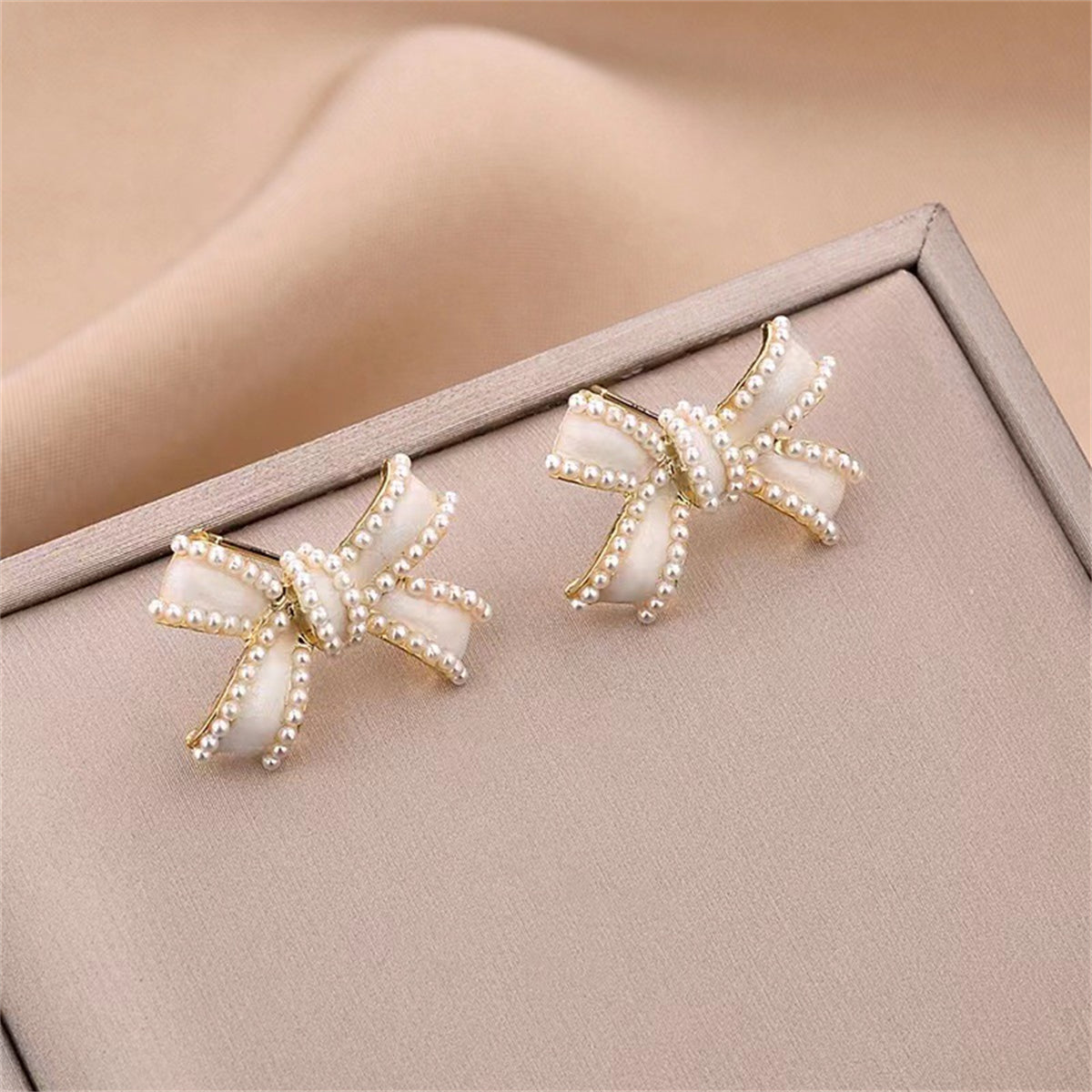 White Enamel and Pearl Bow Stud Earrings, stud earrings for women, everyday style, side view