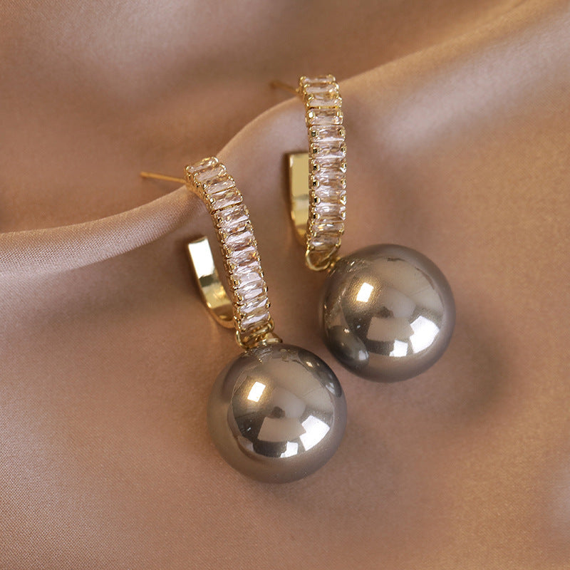 Beautiful gray  pearl and diamond drop earrings, featuring a luxurious 18K gold-plated design with cubic zirconia.