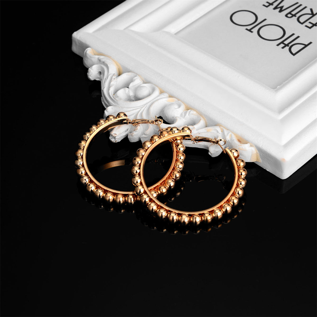 Eye-catching 18K gold-plated hoop earrings with beads, combining elegance and modern flair for a standout look.