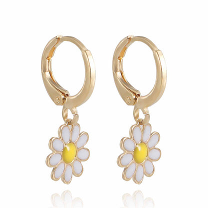 White Enamel and 18K Gold-Plated Daisies Huggie Earrings, gold huggie earrings, dainty minimalist design, front view