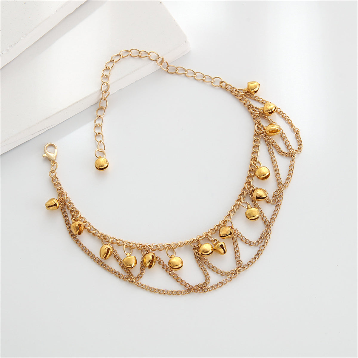Beautiful gold-plated chain anklet showcasing a unique chain link pattern, a must-have for any fashion-forward jewelry collection.