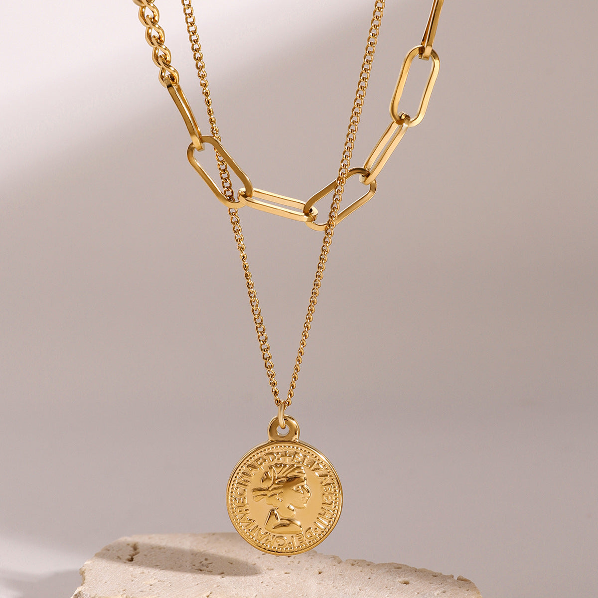Chic 18K gold-plated necklace adorned with a 'Queen Elizabeth' coin charm, a must-have for fashion enthusiasts.