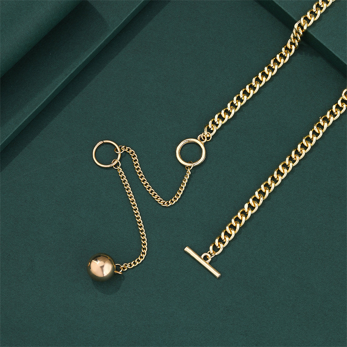 Chic gold chain bracelet with a petite charm, designed to enhance your style with a hint of sophistication.