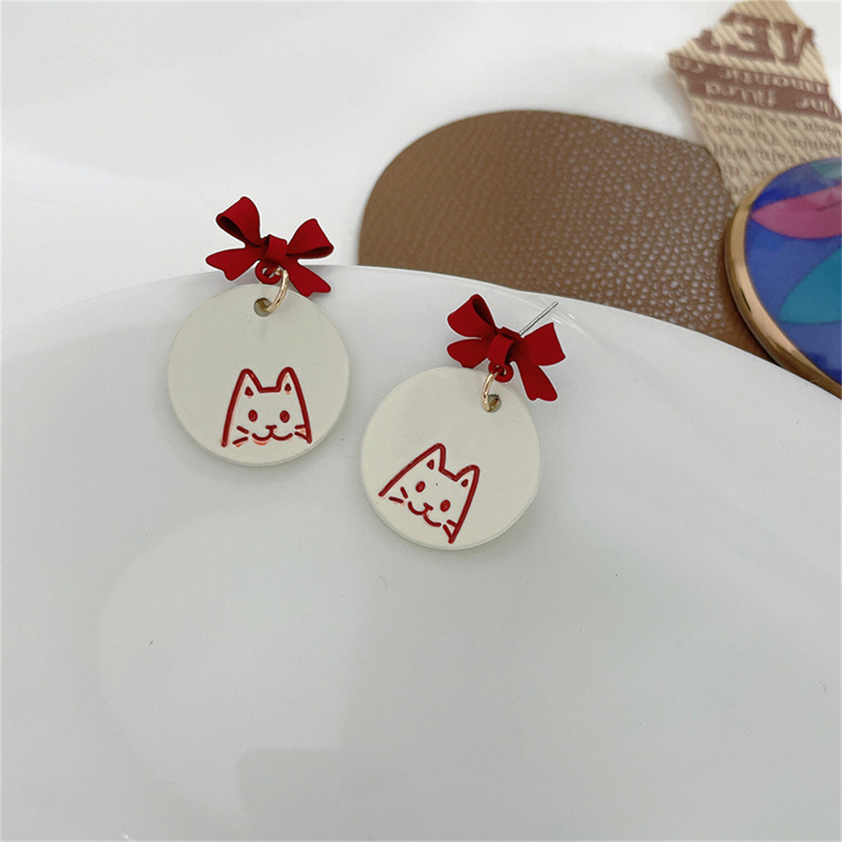 Red and White Enamel Bow Cat Round Drop Earrings, drop earrings for women, dainty minimalist design, detail close-up
