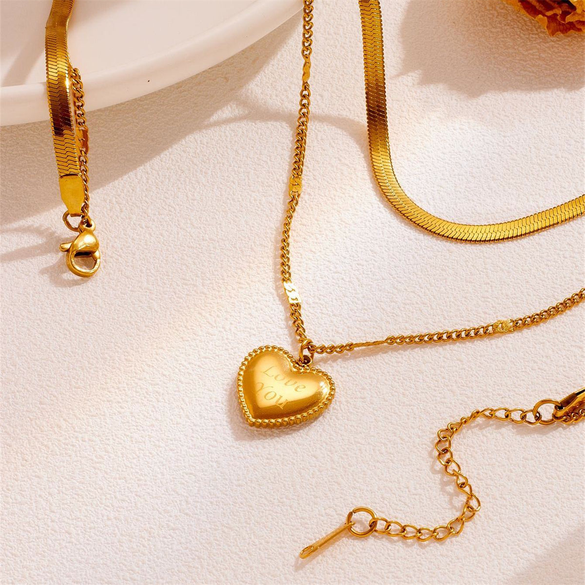 Chic 18K gold-plated layered necklace with a heart pendant inscribed 'Love You', a timeless piece for any jewelry collection.