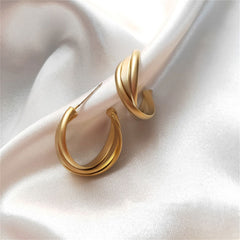 Beautifully crafted 18K gold-plated twisted hoop earrings, a must-have accessory for a glamorous and trendy appearance.