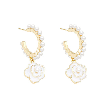 Pearl and White Enamel 18K Gold-Plated Flower Huggie Earrings, gold huggie earrings, dainty minimalist design, front view