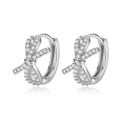 Clear Cubic Zirconia and Silver-Plated Bow Huggie Earrings, silver huggie earrings, everyday style, front view