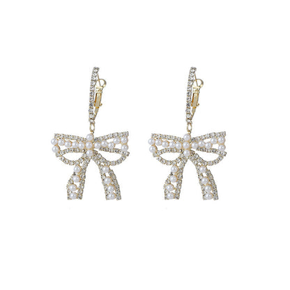 Cubic Zirconia and Pearl Bow Huggie Drop Earrings, huggie earrings, botanical inspired, lifestyle look