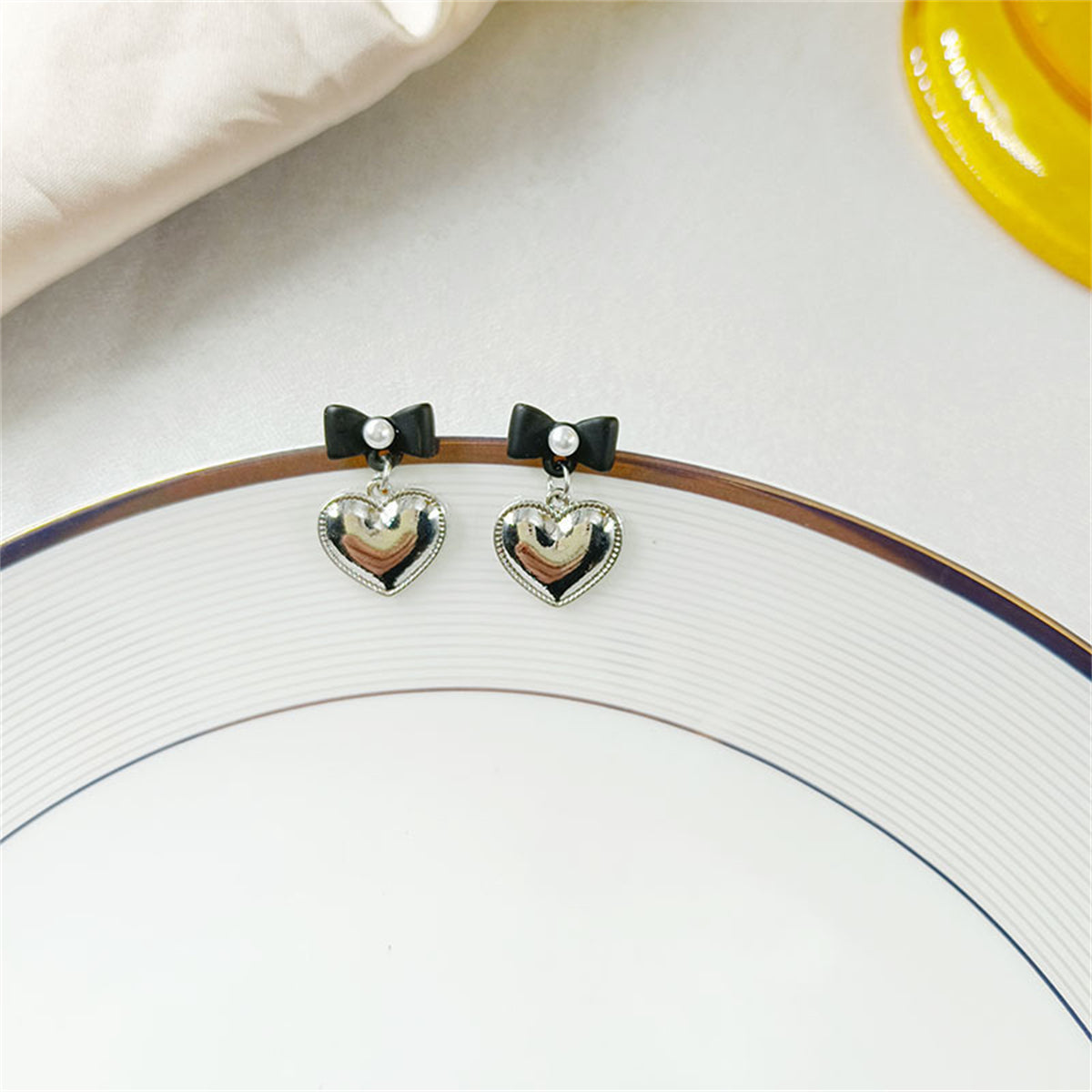 Pearl and Black Enamel Silver-Plated Bow Heart Drop Earrings, silver drop earrings for women, detail close-up