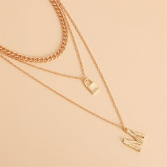 Exquisite 18K gold-plated necklace featuring a layered 'M' lock pendant and key, perfect for making a bold fashion statement.
