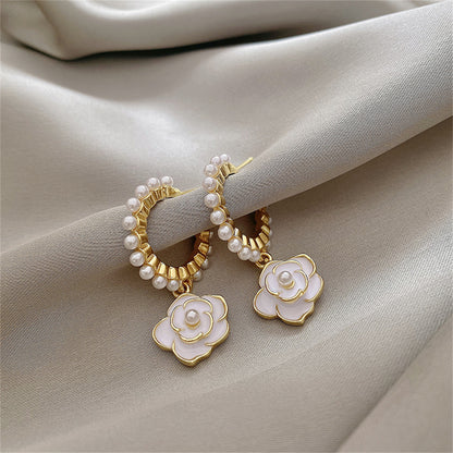 Pearl and White Enamel 18K Gold-Plated Flower Huggie Earrings, gold huggie earrings, dainty minimalist design, side view