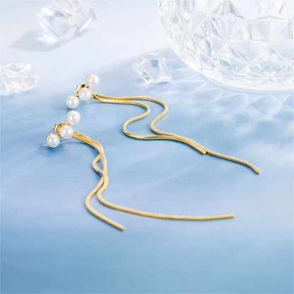 Pearl and 18K Gold-Plated Tassel Ear Jackets, gold drop earrings for women, dainty minimalist design, detail close-up