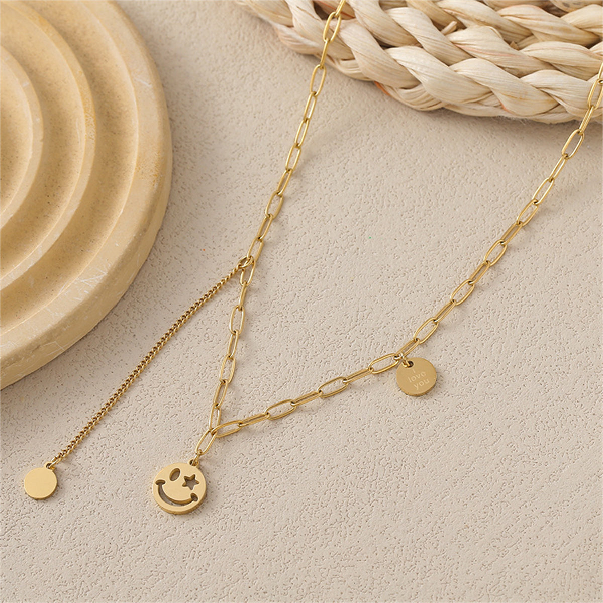 Elegant smiley face drop necklace with a gold chain, designed in 18K gold plating to celebrate love and positivity.