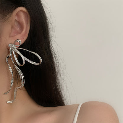Cubic Zirconia and Silver-Plated Twist Bow Drop Earrings, silver drop earrings for women, everyday style, styled look