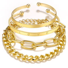 Stunning 18K gold-plated 'Love' cuff set with three chain bracelets adorned with a heart charm for a chic look.