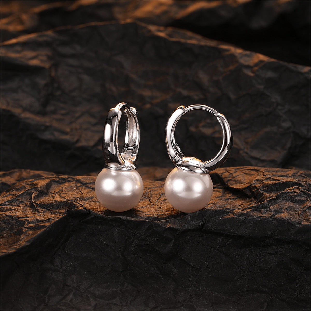 Pearl and Silver-Plated Huggie Earrings, silver huggie earrings, vintage-inspired design, side view