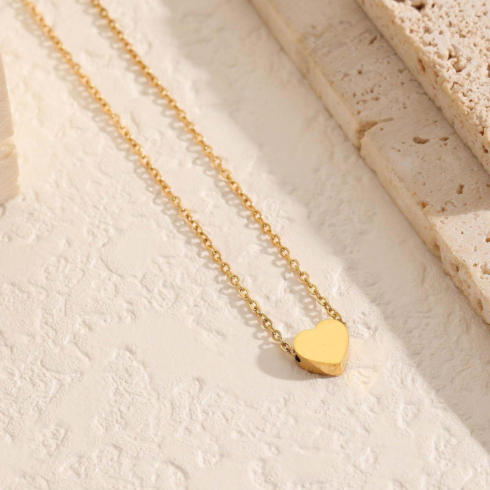 Beautiful 18K gold-plated heart pendant necklace with a petite chain, a timeless piece for any jewelry collection.