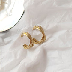 Elegant 18K gold-plated twisted hoop earrings, adding a touch of sophistication to any outfit. Perfect for any occasion.