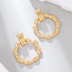Beautiful 18K gold-plated bamboo earrings, designed in a circle drop style, ideal for elevating your accessory game.