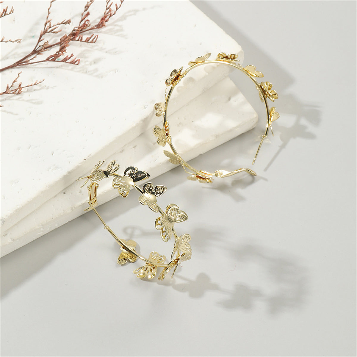 Exquisite 18K gold-plated butterfly hoop earrings, designed to bring a whimsical touch to your everyday ensemble.