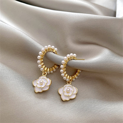 Pearl and White Enamel 18K Gold-Plated Flower Huggie Earrings, gold huggie earrings, detail close-up