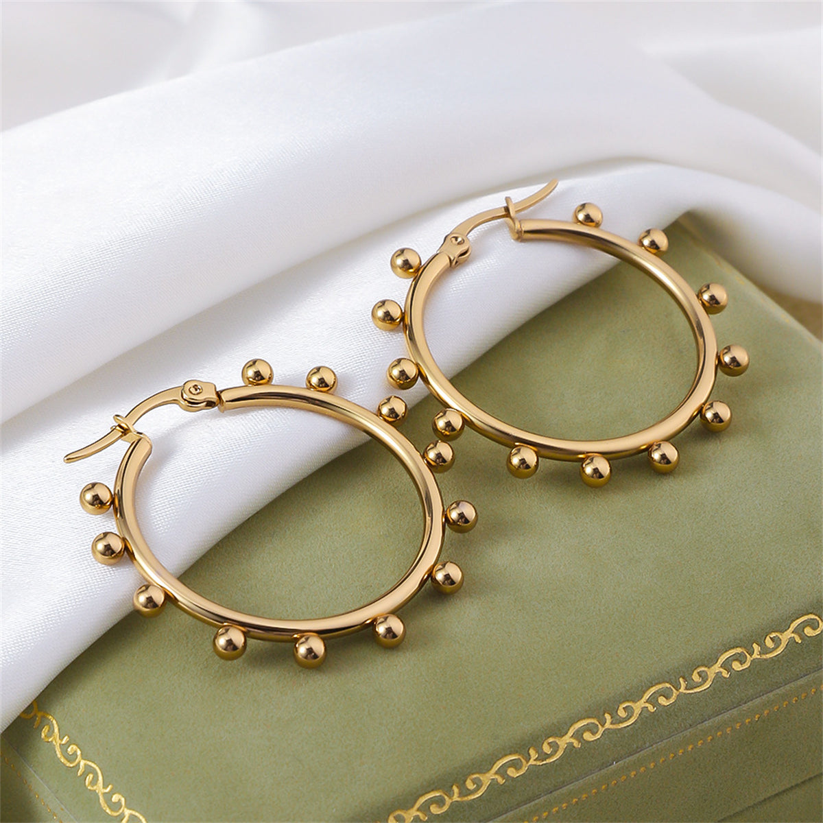 Beautiful gold-plated hoop earrings with beaded details, crafted in 18K gold plating for a stylish and luxurious finish.