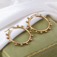 Beautiful gold-plated hoop earrings with beaded details, crafted in 18K gold plating for a stylish and luxurious finish.
