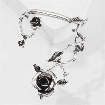 Black Enamel and Silver-Plated Rose Ear Cuff, silver stud earrings for women, vintage-inspired design, detail close-up