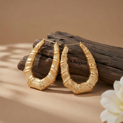 18K Gold-Plated Oval Bamboo Huggie Earrings, gold huggie earrings, botanical inspired, front view