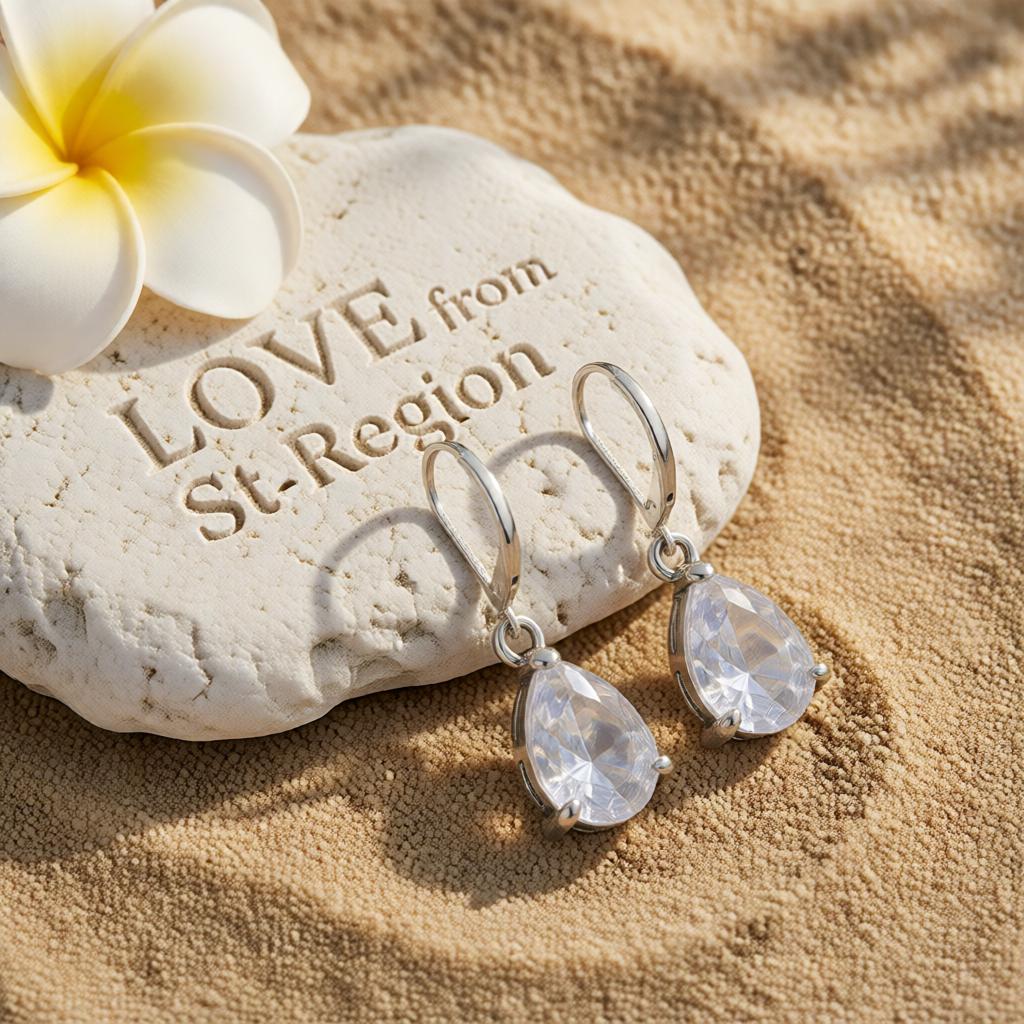 Clear Crystal and Silver-Plated Pear-Cut Drop Earrings, silver huggie earrings, dainty minimalist design, lifestyle look