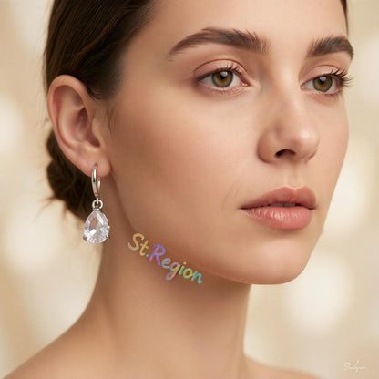 Clear Crystal and Silver-Plated Pear-Cut Drop Earrings, silver huggie earrings, dainty minimalist design, styled look