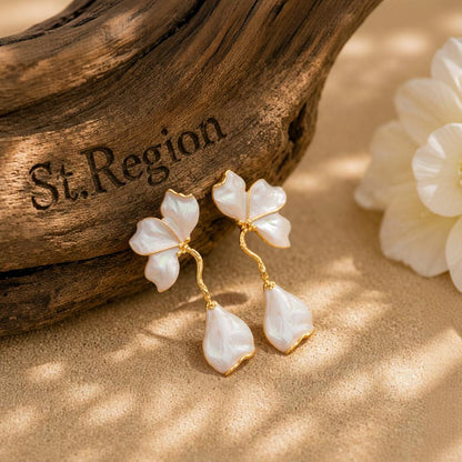 White Enamel and Goldtone Petals Dangle Earrings, gold drop earrings for women, botanical inspired, front view