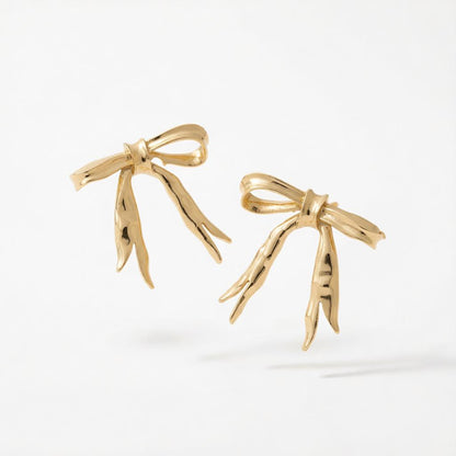 Goldtone Hammered Bow Stud Earrings, cubic zirconia stud earrings for women, botanical inspired, side view