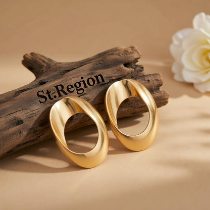 Goldtone Open Oval Statement Earrings, cubic zirconia stud earrings for women, botanical inspired, front view