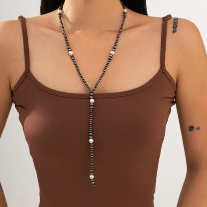 Dark Resin and Pearl Silvertone Beaded Y-Necklace, vintage-inspired design, lifestyle look