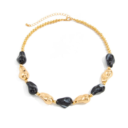 Black Resin and Goldtone Irregular Drop Station Collar Necklace, everyday style, front view