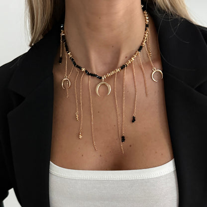 Black Acrylic and Goldtone Moon Pendant Tassel Necklace, dainty minimalist design, lifestyle look
