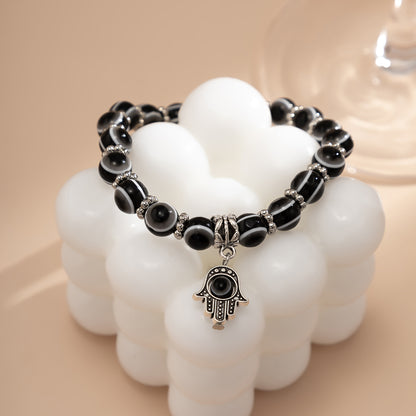 Black Acrylic and Silver-Plated Evil Eye Hamsa Charm Bracelet, silver bracelet for women, vintage-inspired design, side view