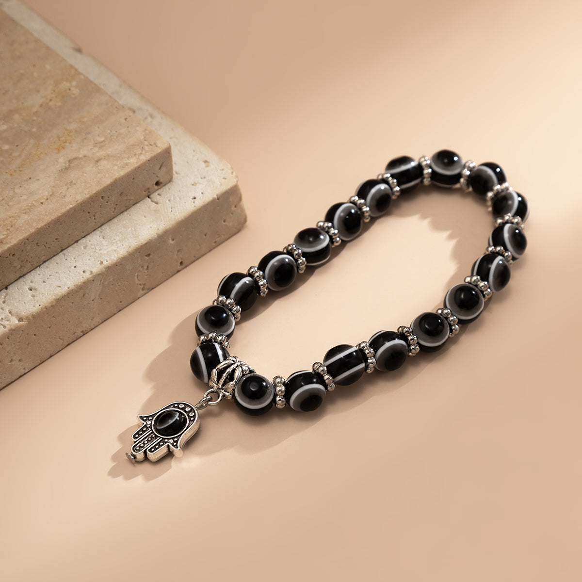 Black Acrylic and Silver-Plated Evil Eye Hamsa Charm Bracelet, silver bracelet for women, detail close-up